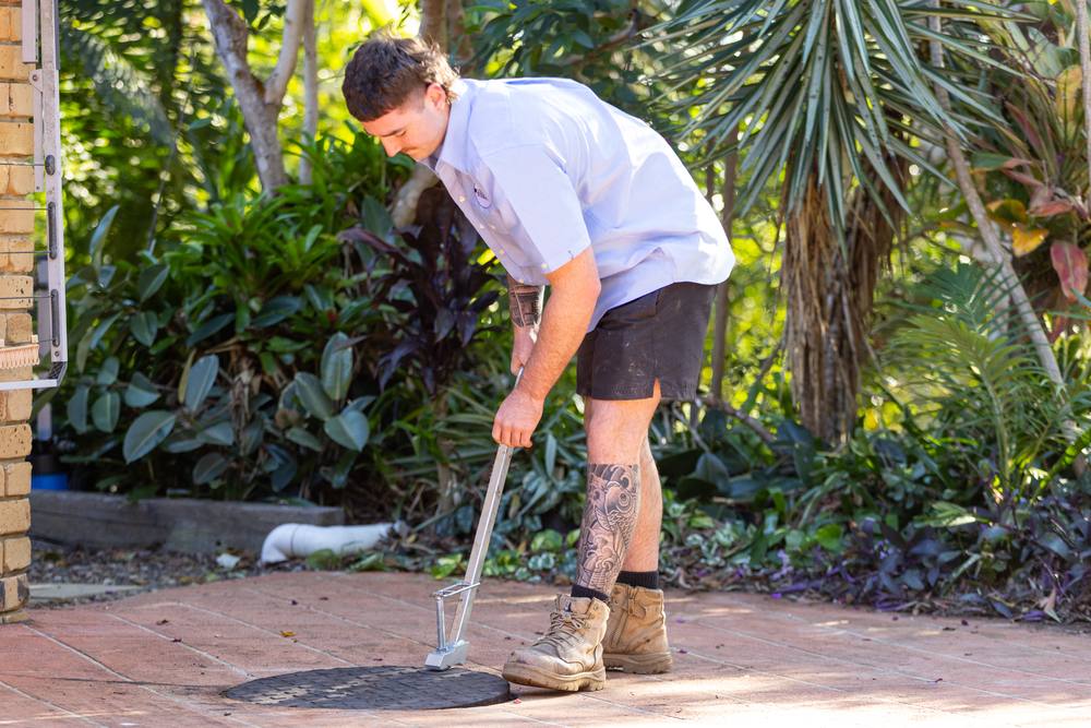 Clearing a blocked drain at the access point