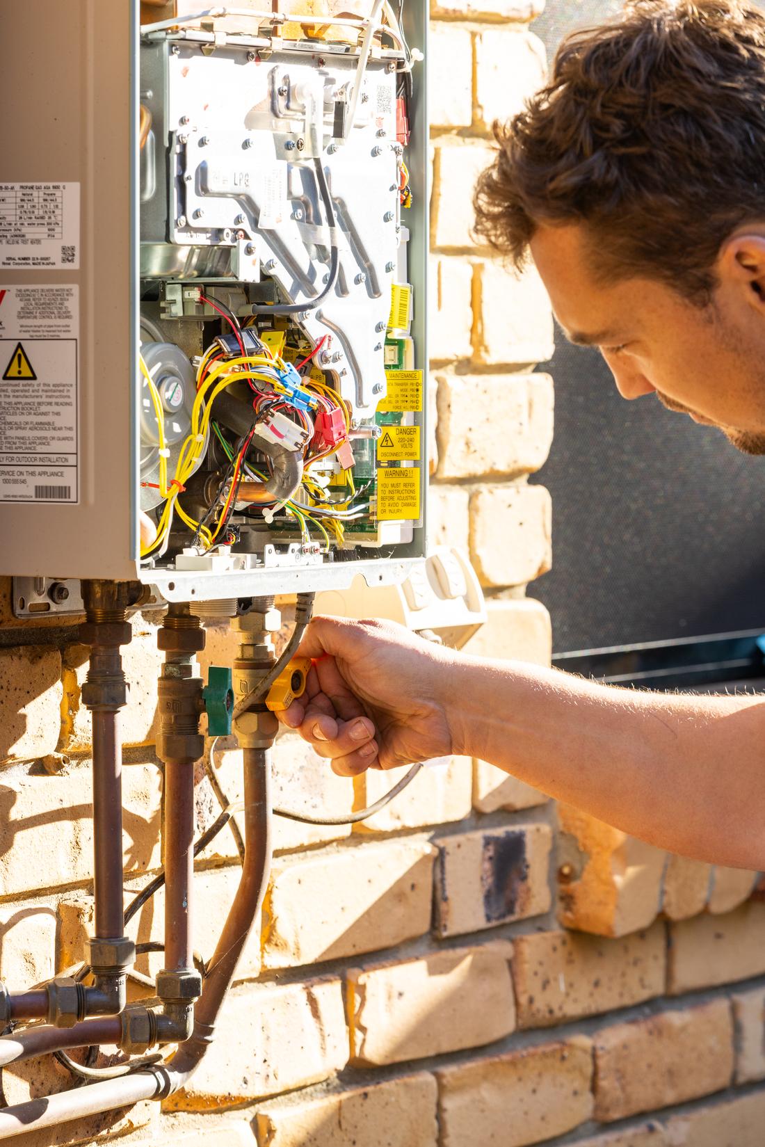 Projection plumber testing a gas connection