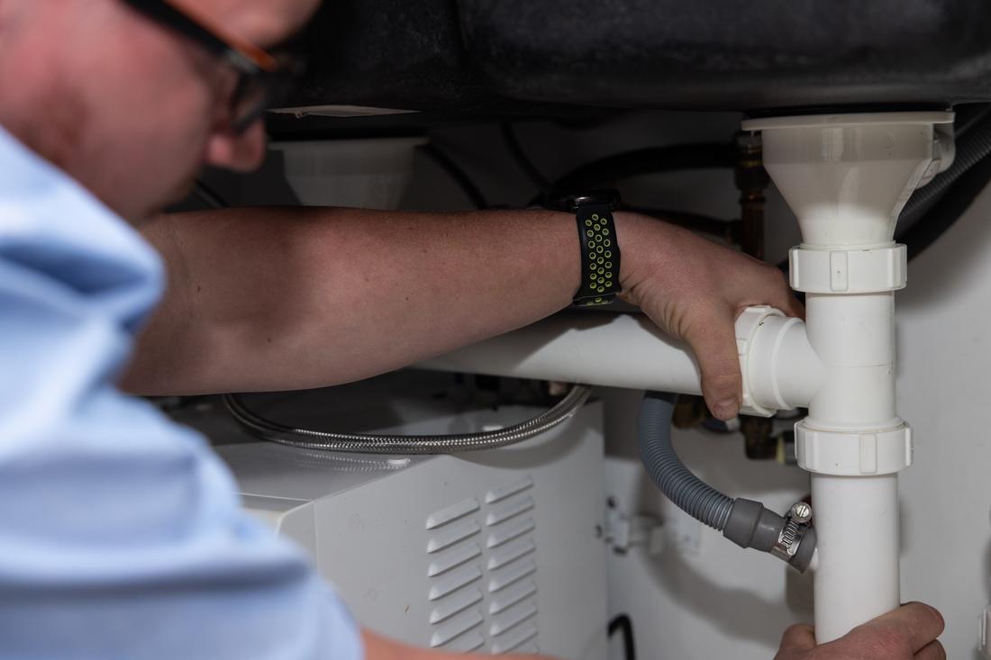 Under-sink pipework repaired by Projection Plumbing